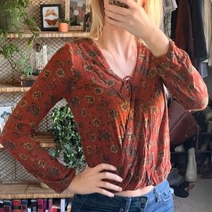 Burnt orange floral blouse